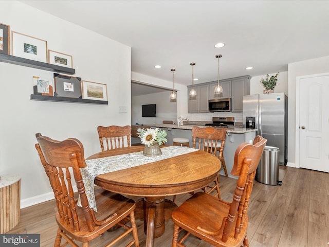 dining area featuring hardwood / wood-style flooring