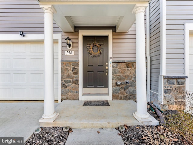 entrance to property featuring a garage