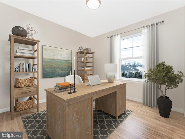 home office with wood-type flooring