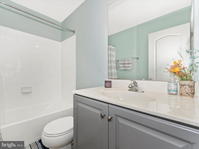 full bathroom with vanity, toilet, and shower / bath combo with shower curtain