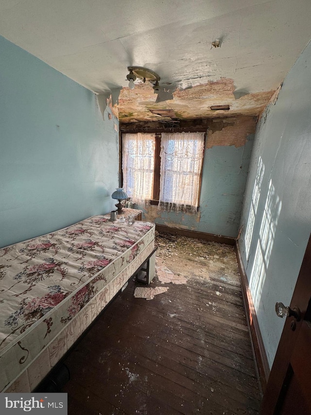 bedroom with hardwood / wood-style floors