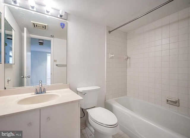 full bathroom with vanity, toilet, and tiled shower / bath