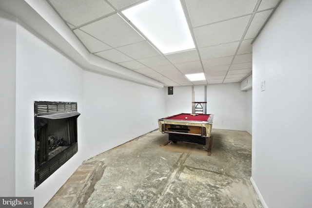 rec room featuring concrete flooring, a paneled ceiling, and pool table