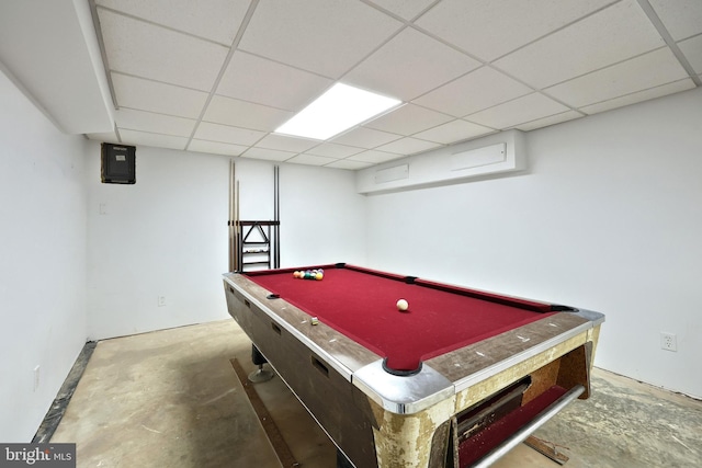 playroom featuring a paneled ceiling, concrete flooring, and billiards