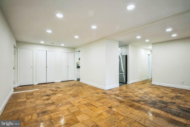 unfurnished room featuring parquet flooring