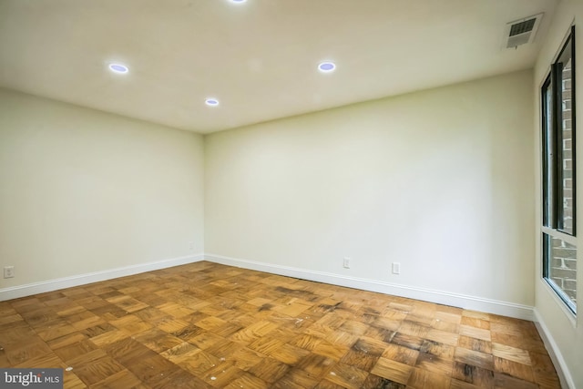 spare room with parquet flooring