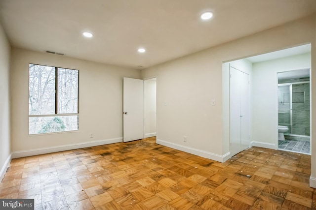 unfurnished room with light parquet floors