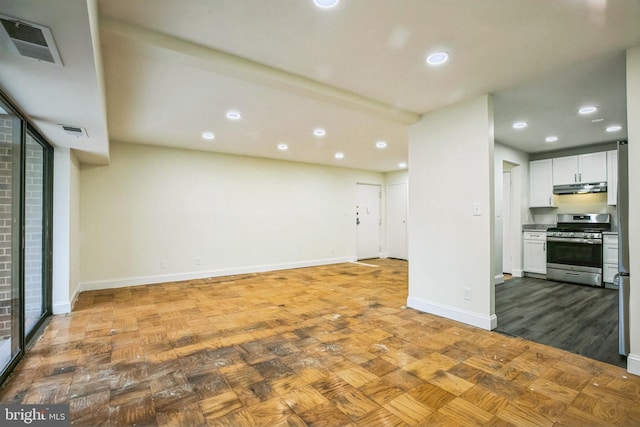 unfurnished living room featuring light parquet flooring