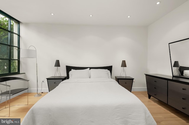 bedroom with light hardwood / wood-style floors