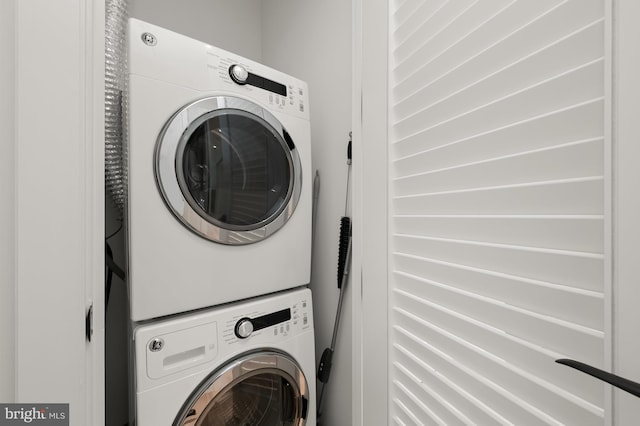 laundry room featuring stacked washing maching and dryer