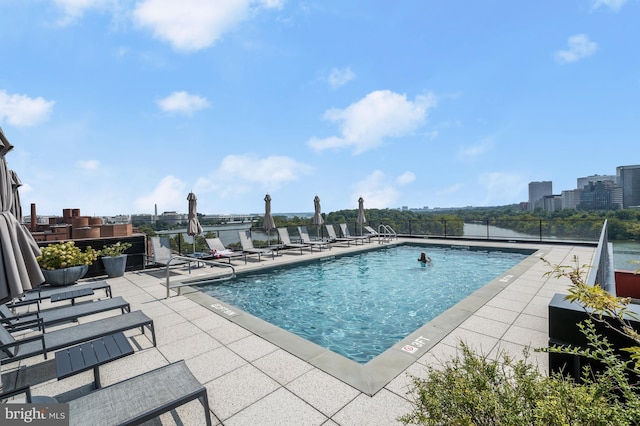 view of swimming pool with a patio