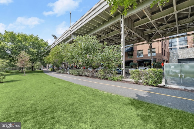 view of home's community with a lawn