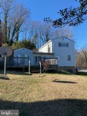 exterior space featuring a wooden deck and a yard