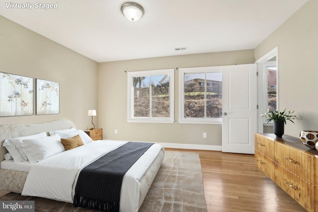 bedroom with light hardwood / wood-style floors