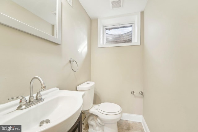 bathroom with toilet and sink