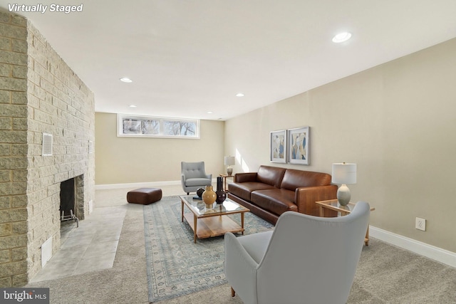 living room featuring a brick fireplace