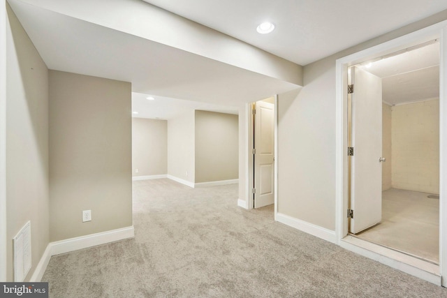 basement with light colored carpet