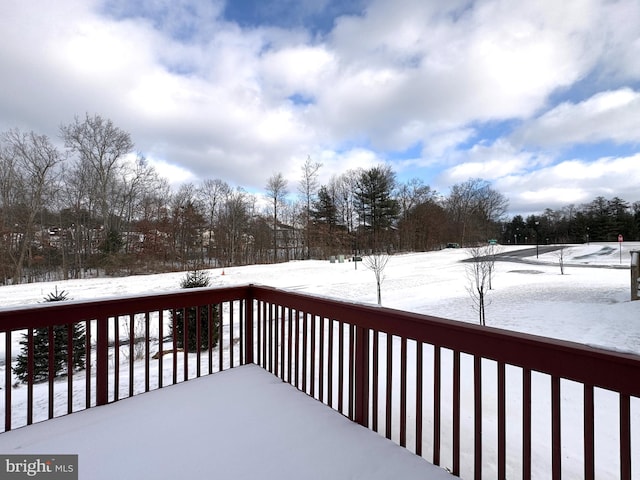 view of snow covered deck