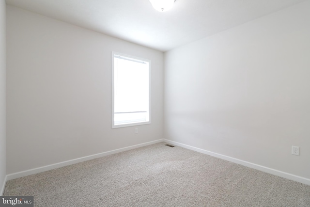 view of carpeted spare room