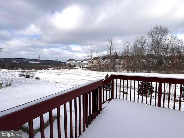 view of snow covered deck