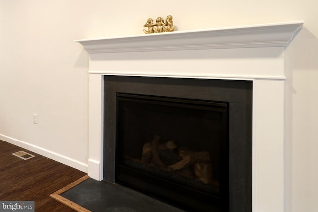 interior details featuring hardwood / wood-style floors