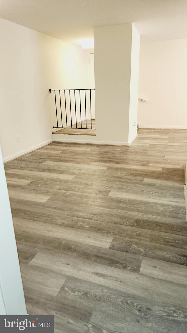 spare room featuring hardwood / wood-style flooring