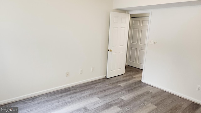 spare room featuring light hardwood / wood-style floors