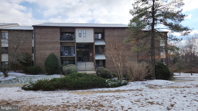 view of snow covered property