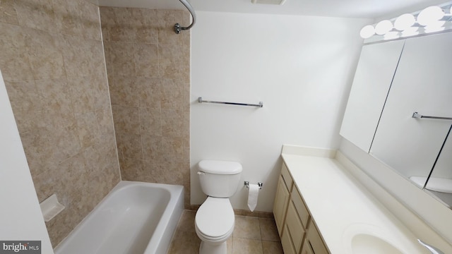 full bathroom with toilet, vanity, tiled shower / bath combo, and tile patterned flooring