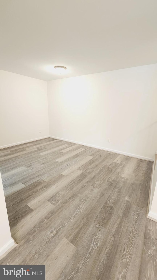 unfurnished room with light hardwood / wood-style floors