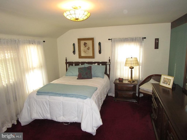 carpeted bedroom featuring vaulted ceiling