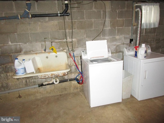 clothes washing area featuring independent washer and dryer