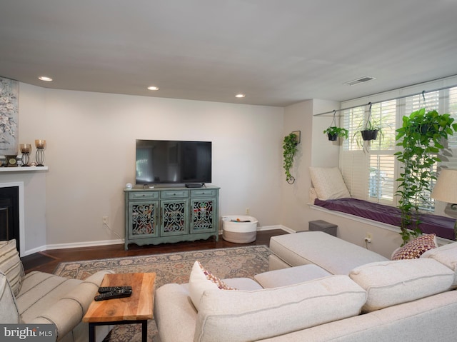 living room with dark hardwood / wood-style flooring