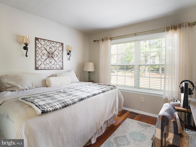 bedroom featuring dark wood-type flooring