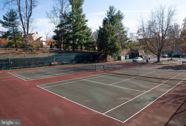 view of tennis court with basketball hoop