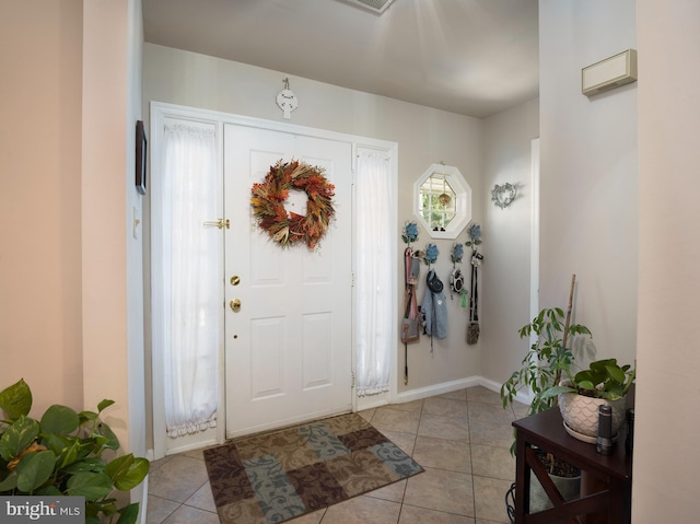 tiled foyer entrance featuring a healthy amount of sunlight