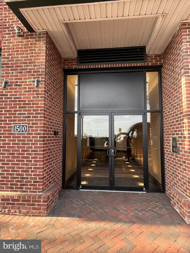 entrance to property featuring french doors