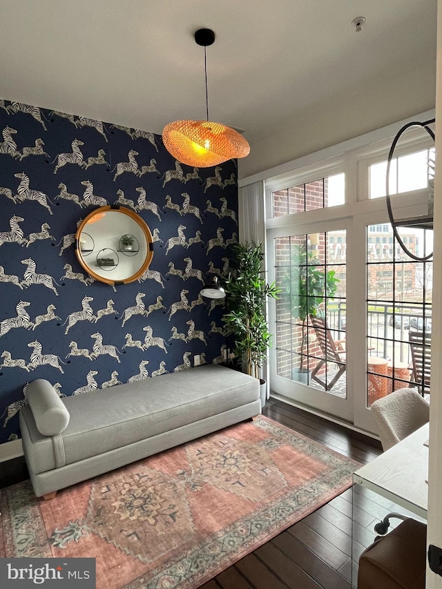 living room with hardwood / wood-style flooring and a healthy amount of sunlight