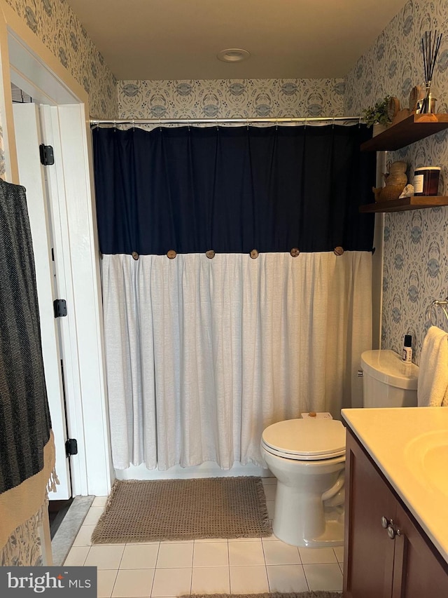 full bathroom with tile patterned flooring, vanity, shower / bath combo, and toilet