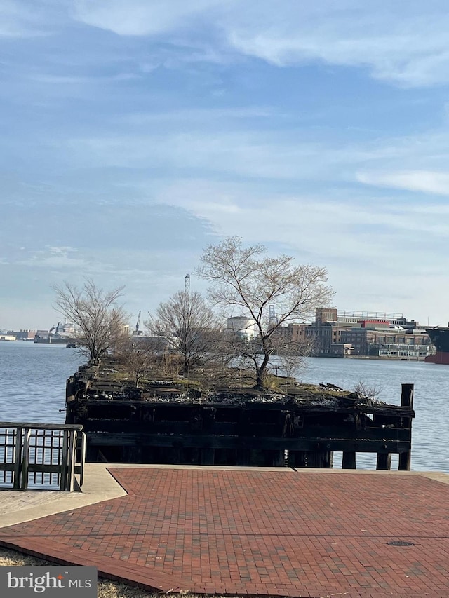 view of patio with a water view