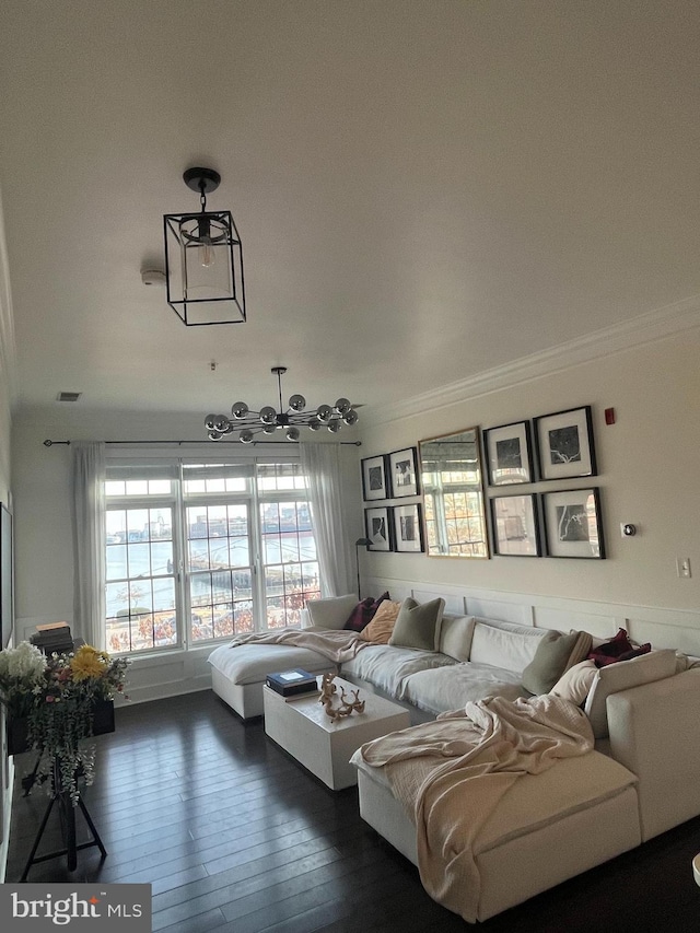 living room with dark hardwood / wood-style floors and ornamental molding