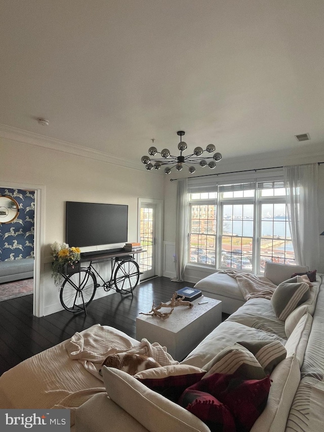 living room featuring dark hardwood / wood-style floors, ceiling fan, and crown molding