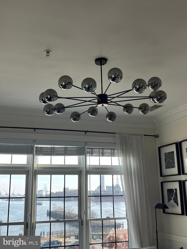 room details featuring a water view and crown molding