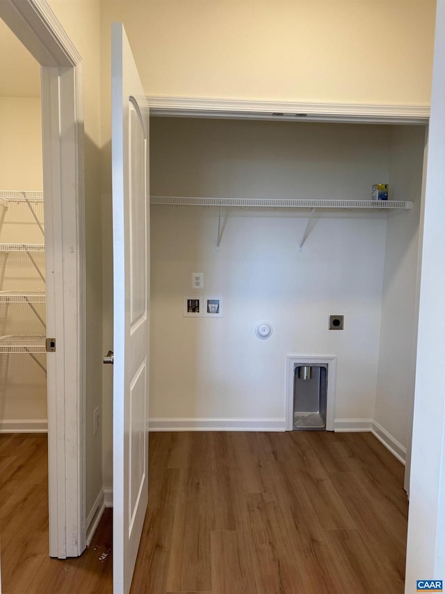 laundry room with electric dryer hookup, gas dryer hookup, dark hardwood / wood-style flooring, and washer hookup