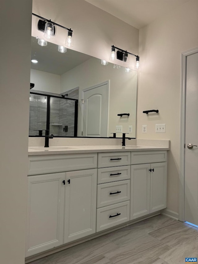 bathroom with vanity and an enclosed shower