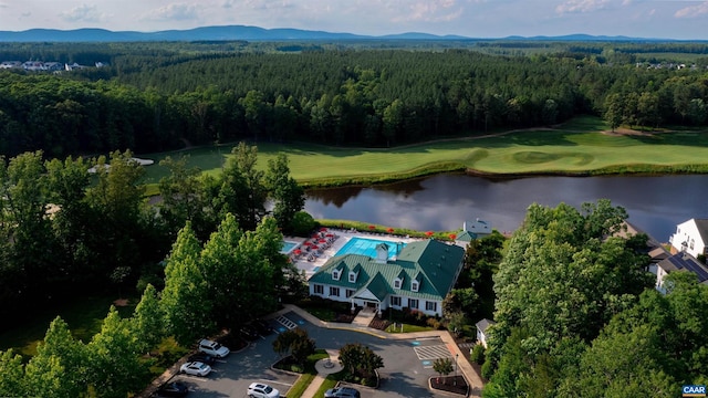 drone / aerial view with a water and mountain view