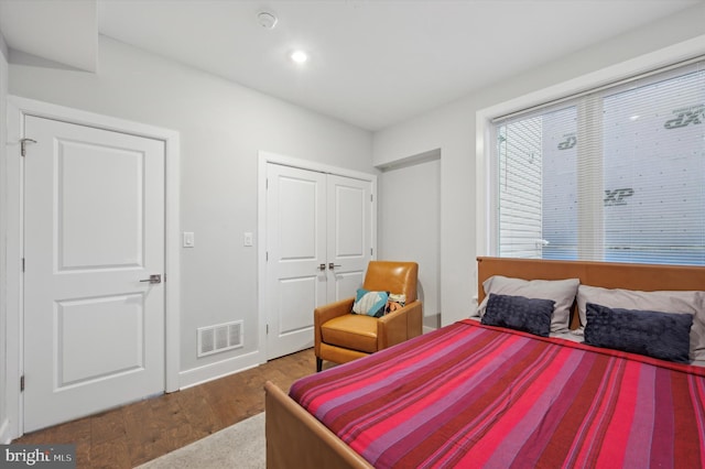 bedroom featuring a closet and wood-type flooring