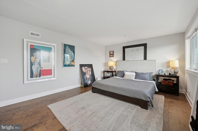 bedroom featuring dark hardwood / wood-style flooring