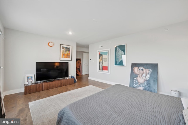 bedroom with dark wood-type flooring