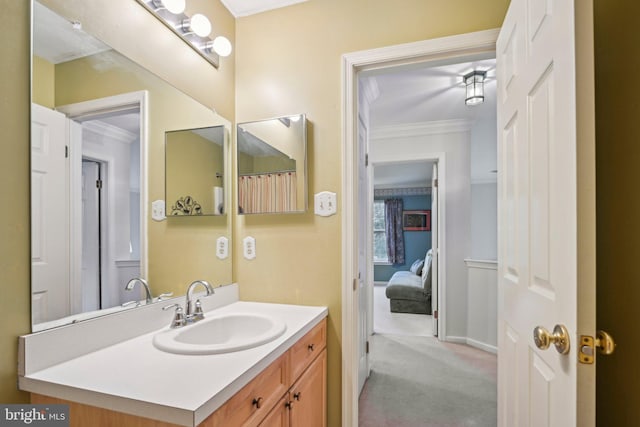 bathroom featuring vanity and crown molding